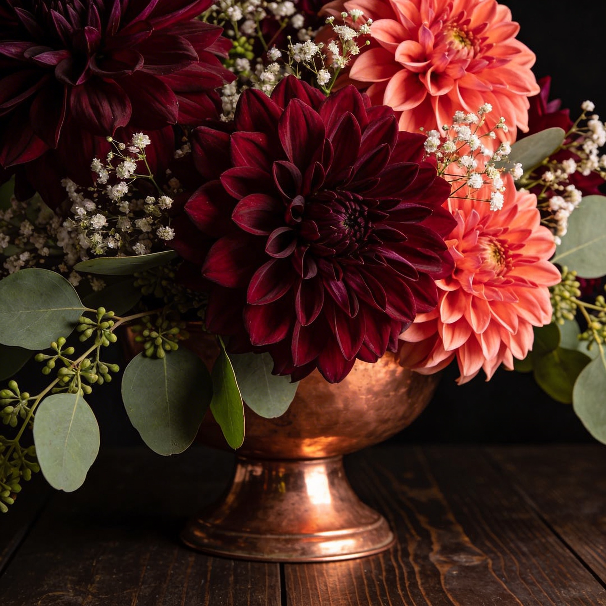 Dramatic dahlia arrangement in burgundy and coral